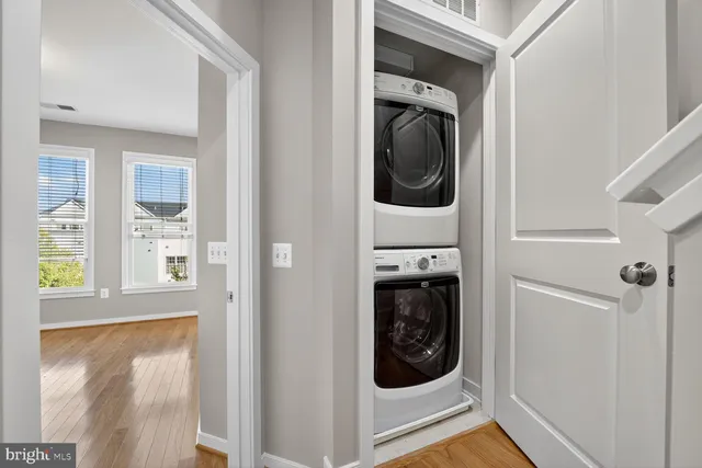 a view of a hallway with washer and dryer
