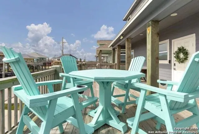 a view of an chairs and table in the balcony
