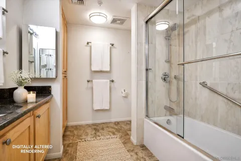 a bathroom with a granite countertop sink mirror bathtub and shower