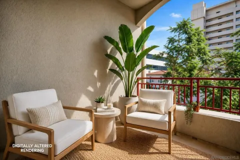 a reading room with furniture and a potted plant