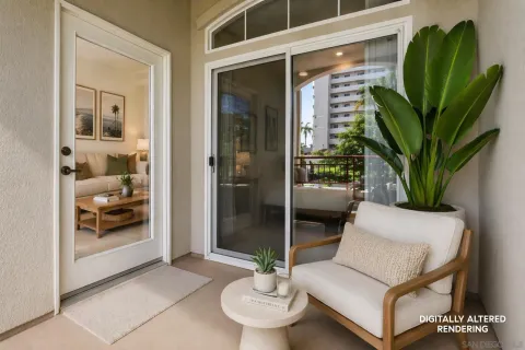 a living room with furniture and a potted plant