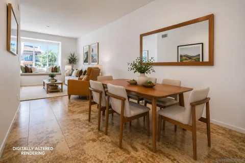 a dining room with furniture and wooden floor