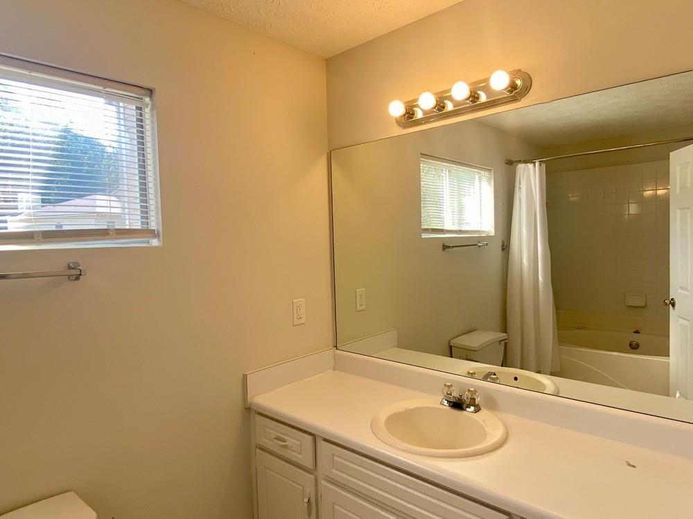 3763 Soapstone Road Decatur, GA 30034 - Photo 9 of 10 a bathroom with a sink and a mirror