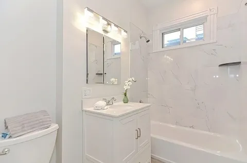 a bathroom with a sink a toilet and a bathtub