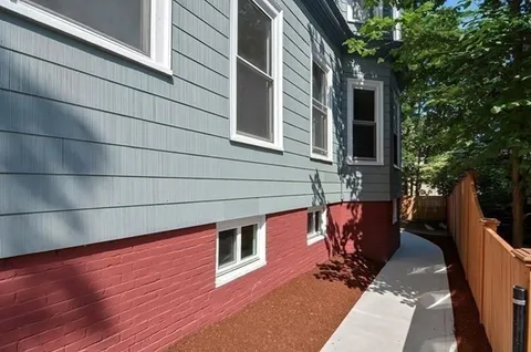 a backyard of a house with seating space