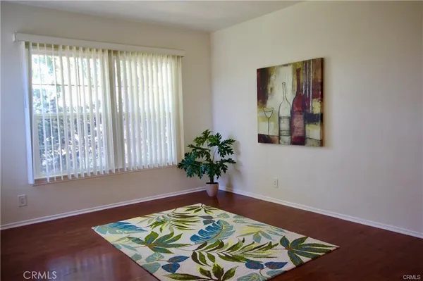 a view of a room that has a bed in it