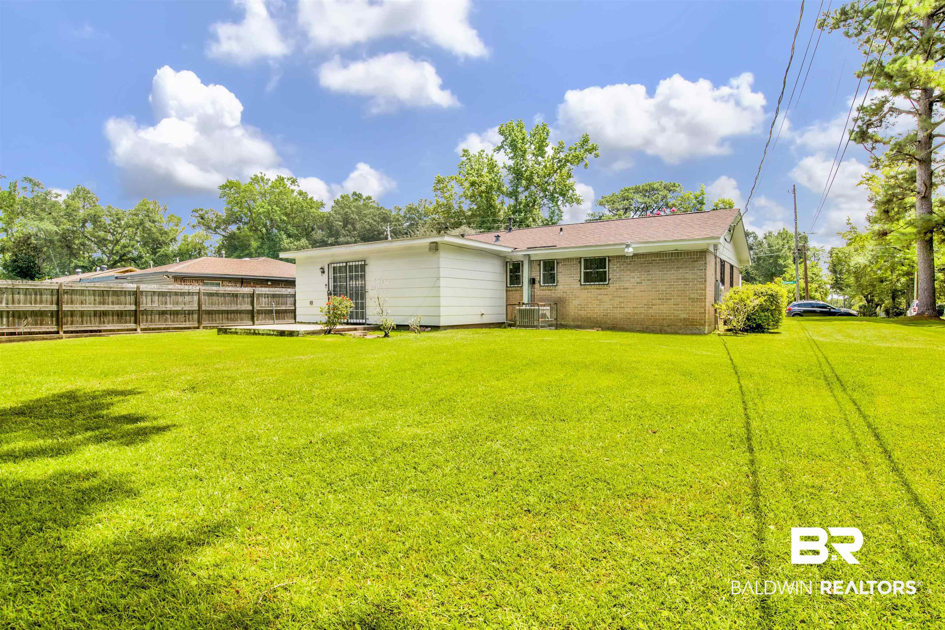 1476 Boudousquie Street Mobile, AL 36605 - Photo 27 of 34 Back of house featuring brick siding