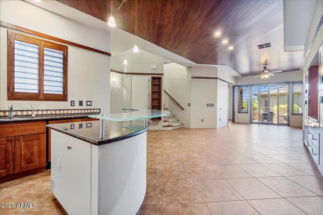 a view of a hallway with cabinet and a living room