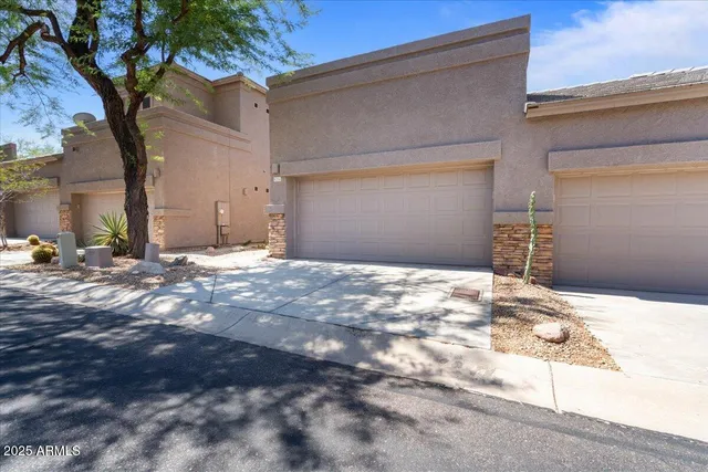 a view of an entryway with wooden floor and door