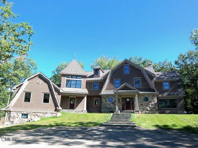 84 Mountain Road Redding, CT 06896 - Photo 1 of 1 a front view of a house with yard