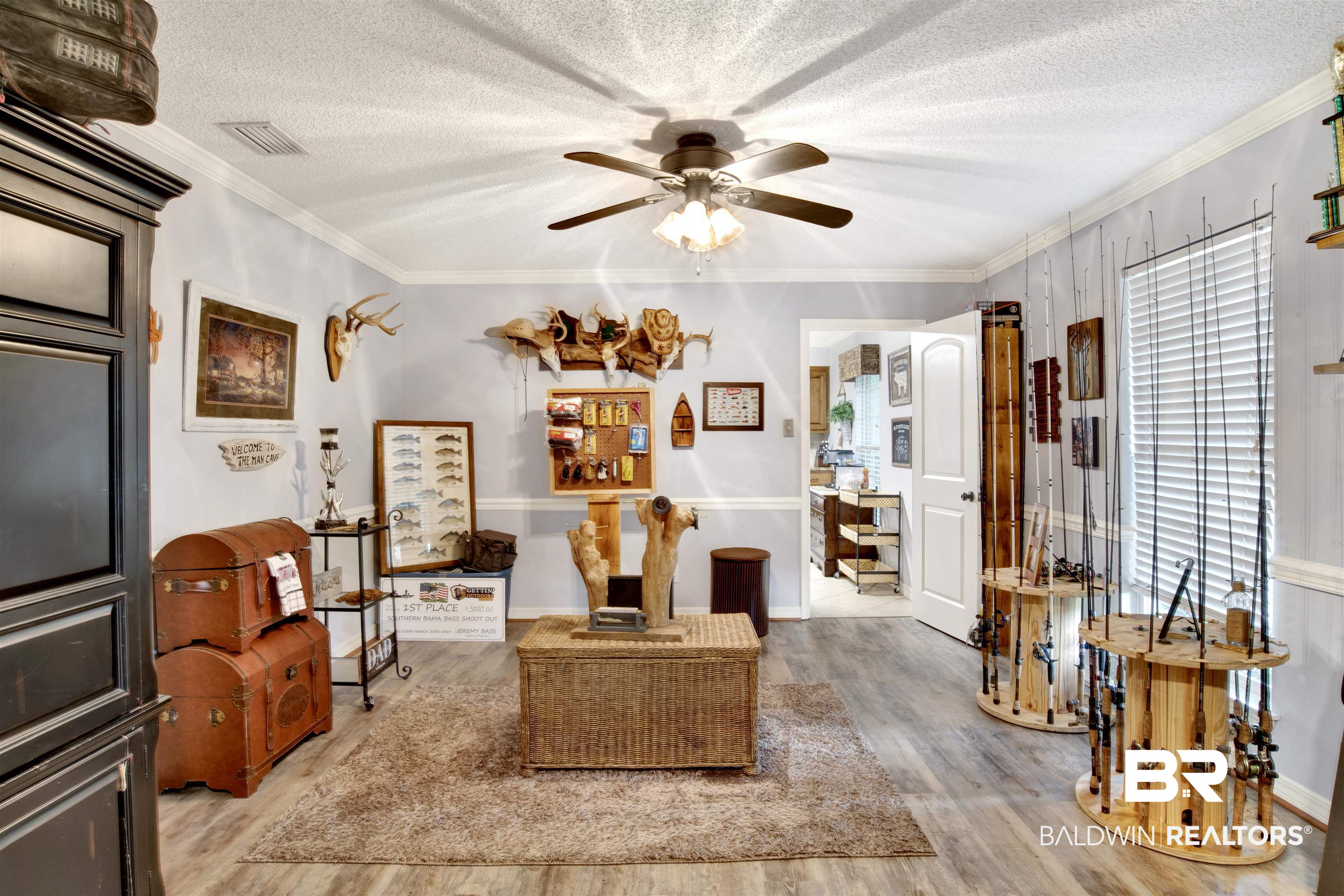 13385 Tom Gaston Road Mobile, AL 36695 - Photo 15 of 42 Living room with light wood-type flooring, a textured ceiling, ornamental molding, and ceiling fan