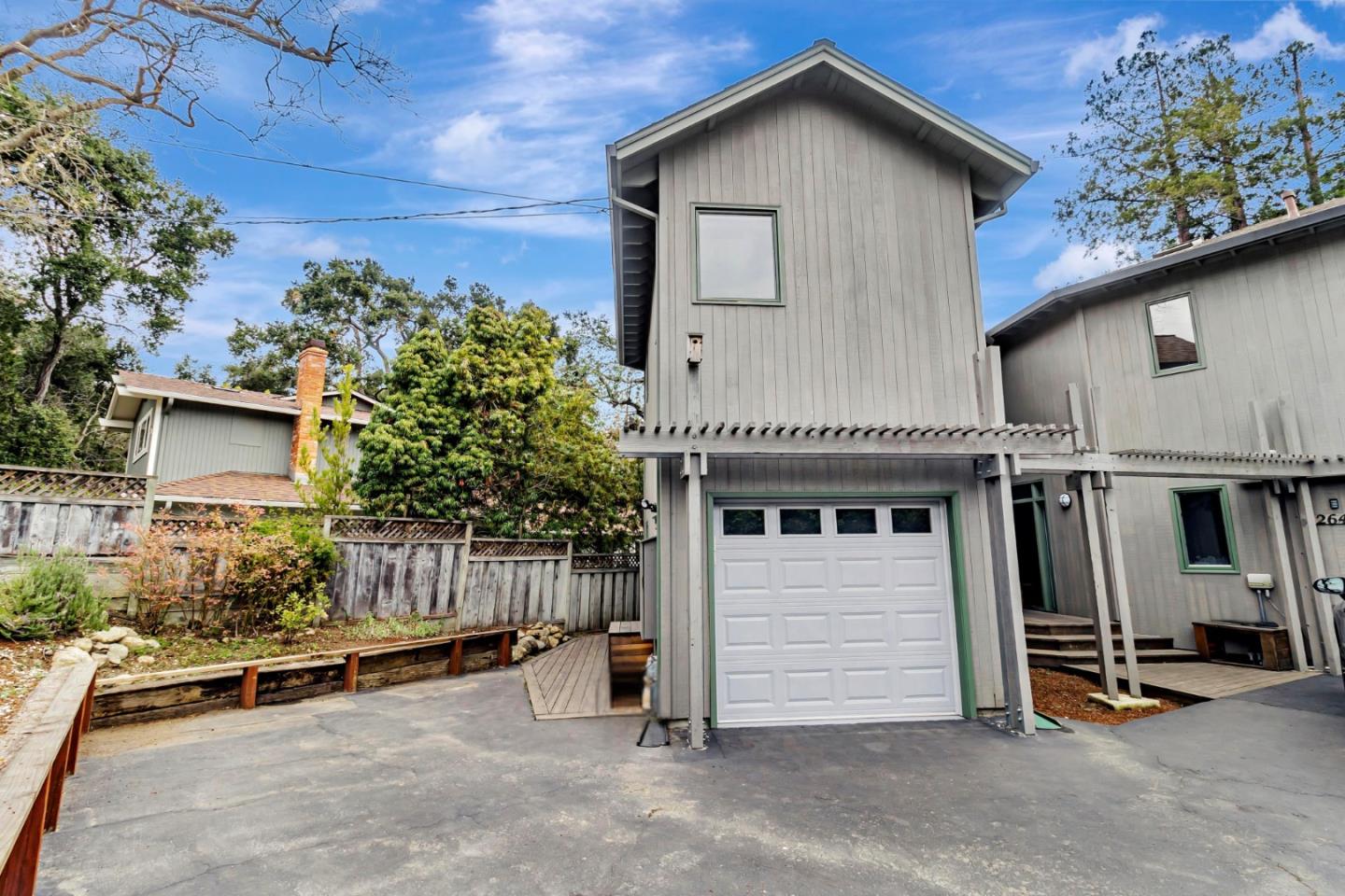 a front view of a house with garage