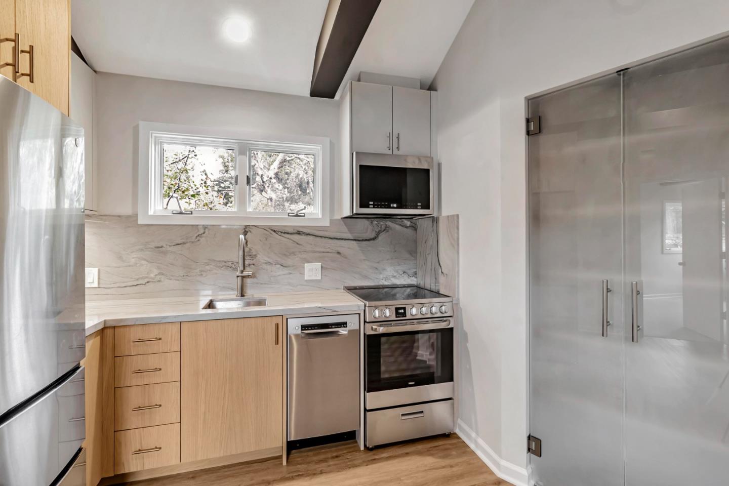 2647 Alpine Road Menlo Park, CA 94025 - Photo 8 of 29 a kitchen with a stove a sink and a microwave