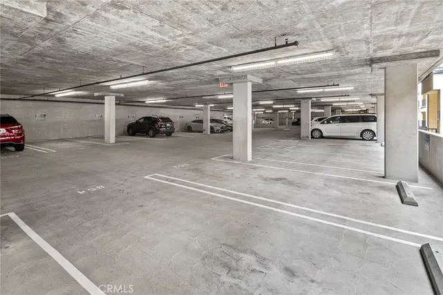 a view of parking garage with cars