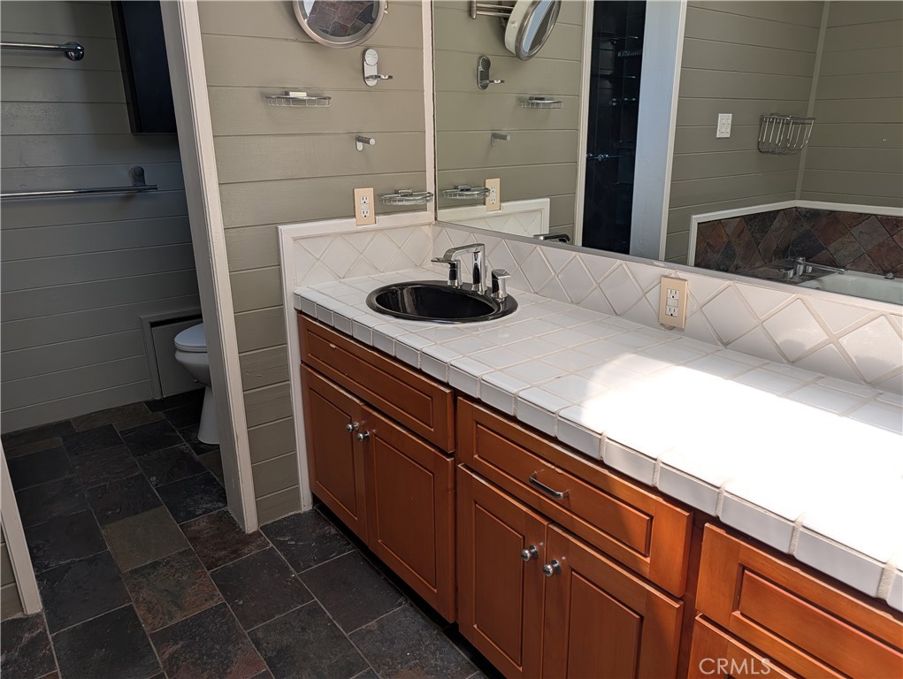 1451 3rd Street Manhattan Beach, CA 90266 - Photo 11 of 23 a kitchen with a sink and a stove top oven