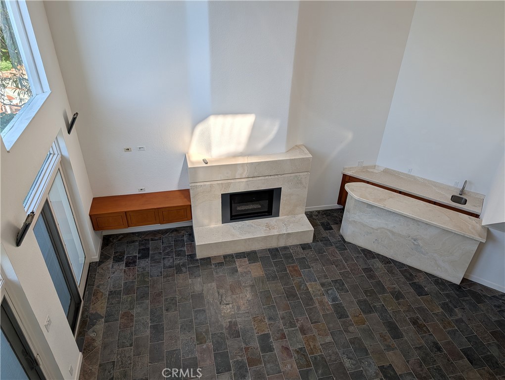 1451 3rd Street Manhattan Beach, CA 90266 - Photo 18 of 23 a living room with furniture and a fireplace