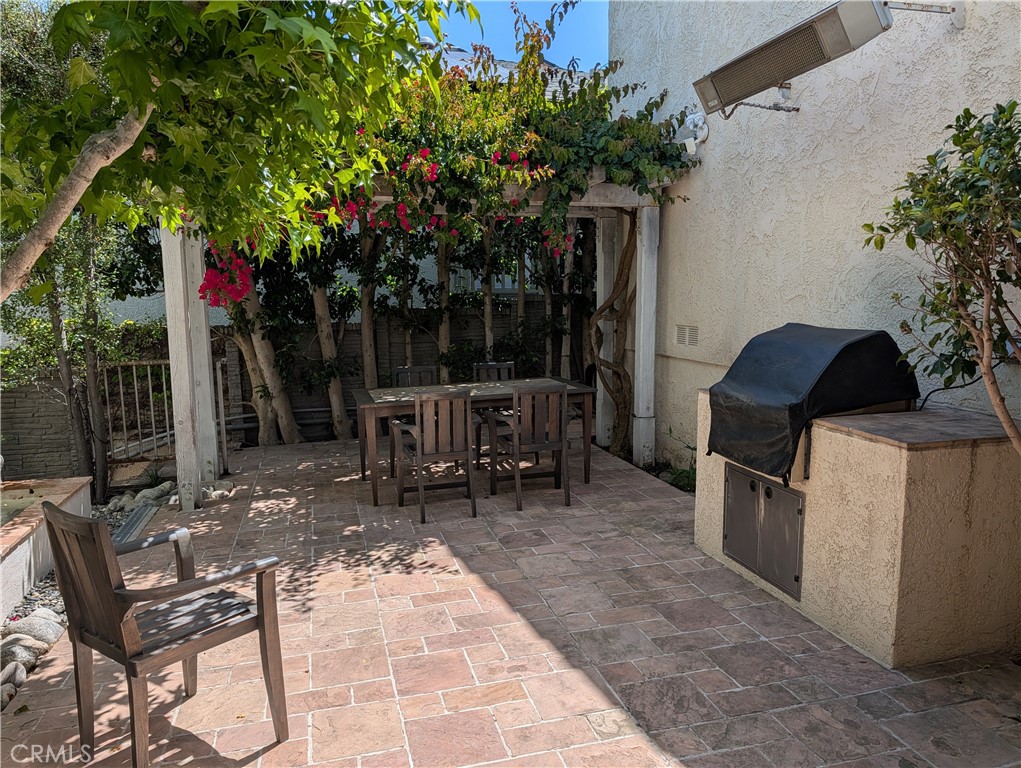 1451 3rd Street Manhattan Beach, CA 90266 - Photo 4 of 23 a view of a chairs and table in backyard