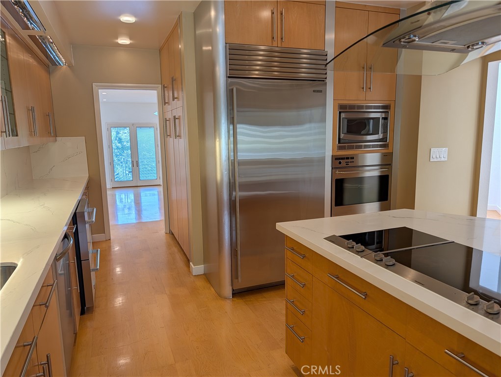1451 3rd Street Manhattan Beach, CA 90266 - Photo 6 of 23 a kitchen with stainless steel appliances granite countertop a refrigerator and a sink