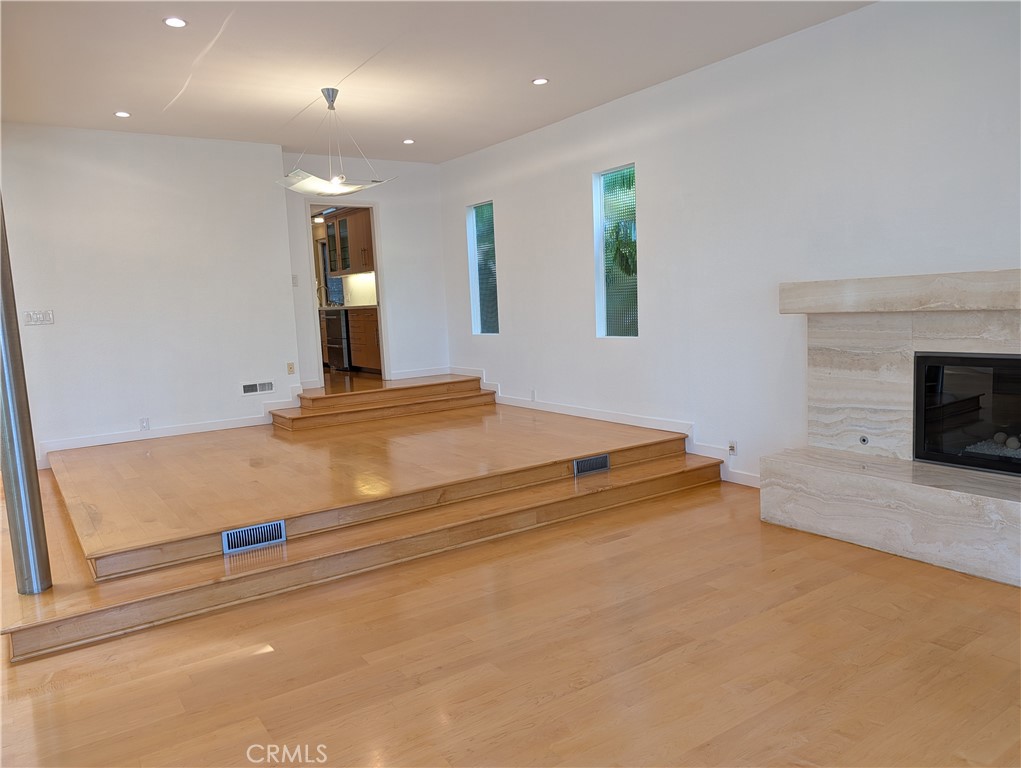 1451 3rd Street Manhattan Beach, CA 90266 - Photo 8 of 23 a view of an empty room with a fireplace