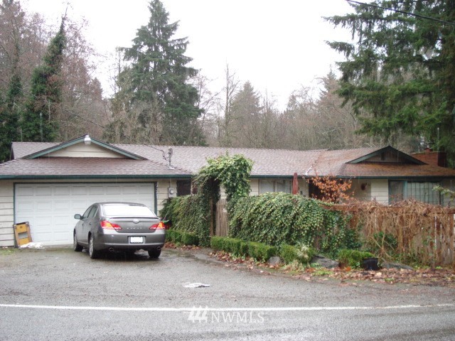 2027 Castle Drive Bothell, WA 98021 - Photo 1 of 1 a car parked in front of a house