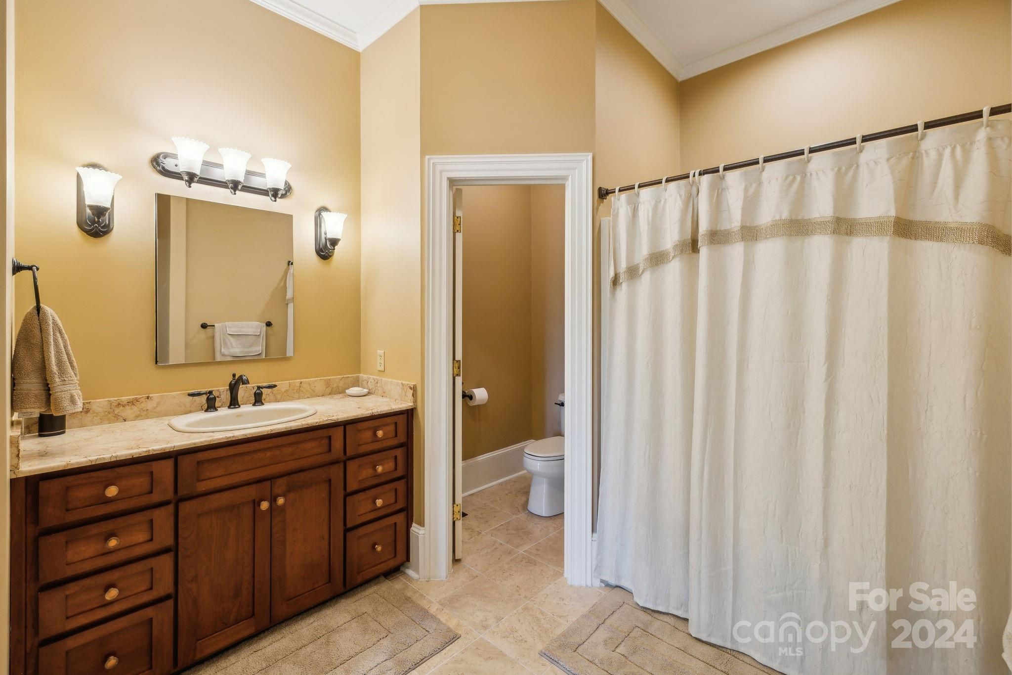 5712 Summit Road Purlear, NC 28665 - Photo 20 of 48 a bathroom with a double vanity sink and a mirror