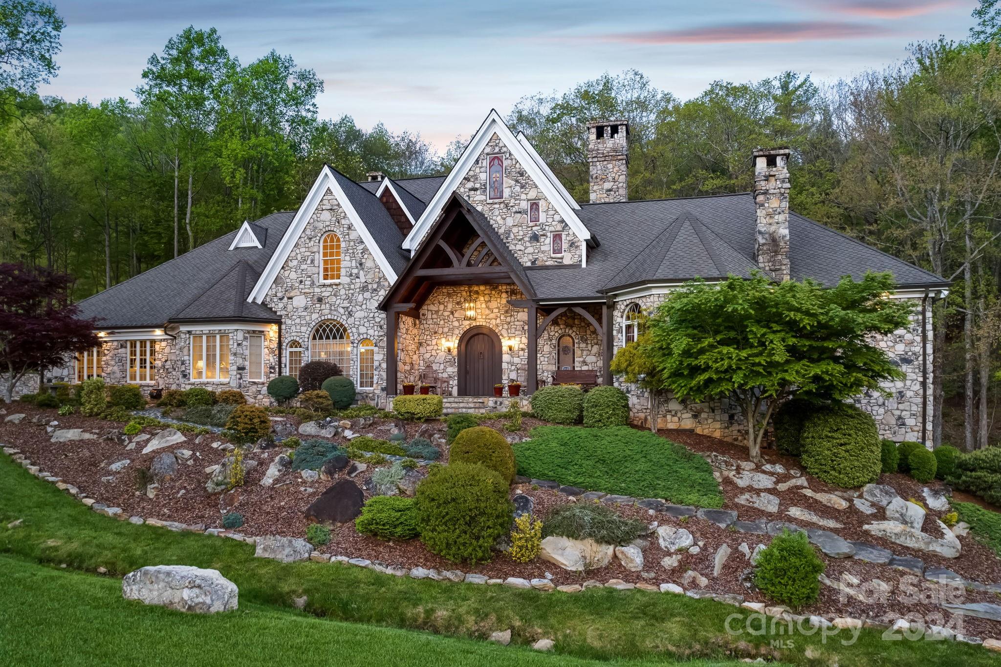 5712 Summit Road Purlear, NC 28665 - Photo 2 of 48 a front view of a house with garden