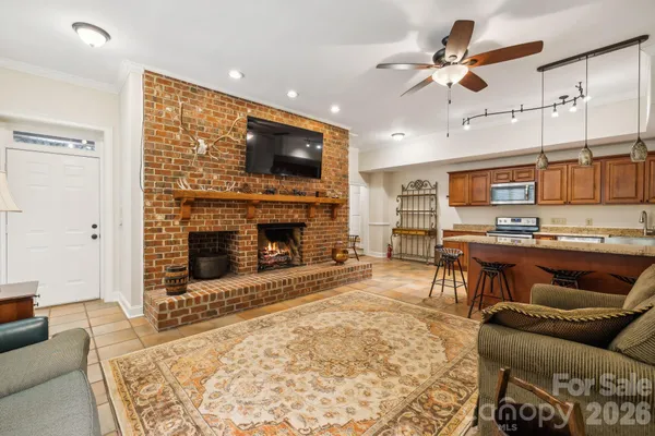a view of entryway livingroom and hall with wooden floor
