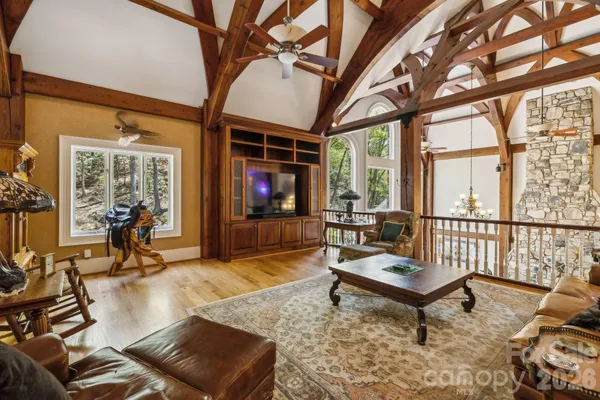 a living room with furniture table and wooden floor
