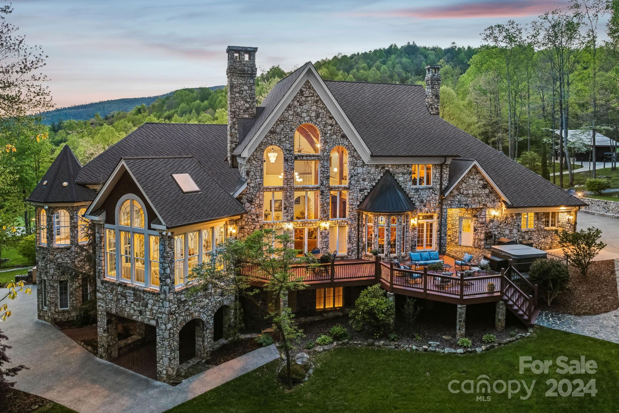5712 Summit Road Purlear, NC 28665 - Photo 4 of 48 a aerial view of a house with a yard balcony and outdoor seating
