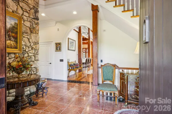 a view of an entryway with furniture and rug