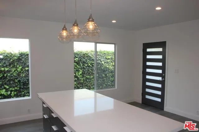 a view of a room with window and stairs