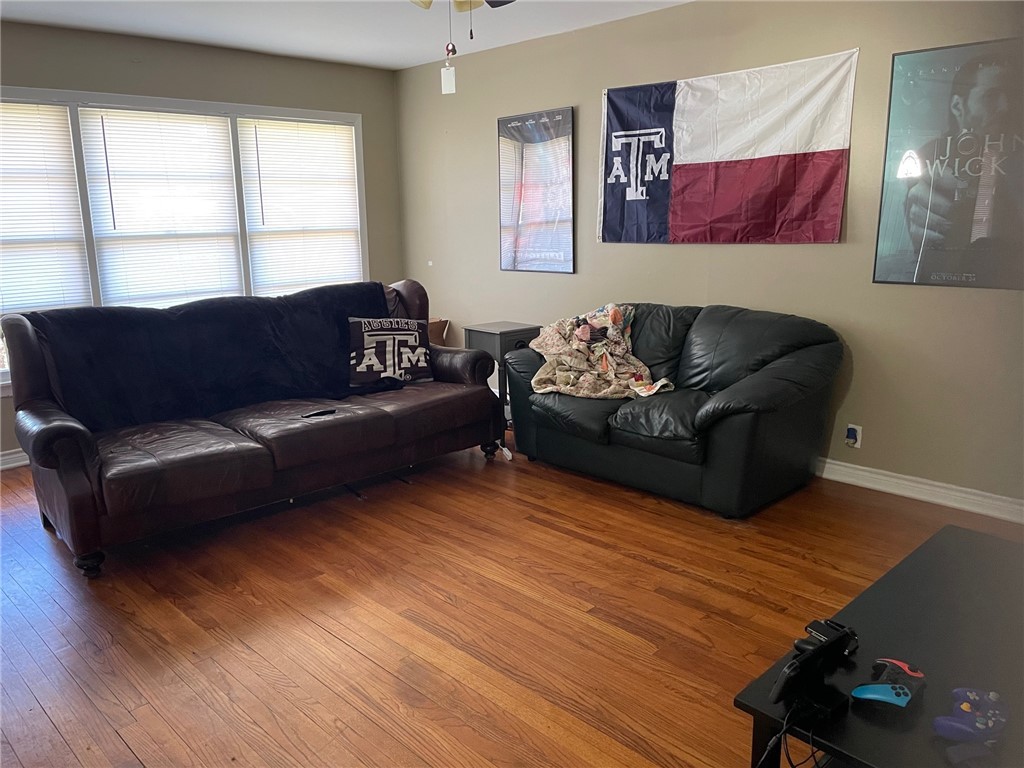 4400 Oaklawn Street Bryan, TX 77801 - Photo 2 of 7 a living room with furniture and a window