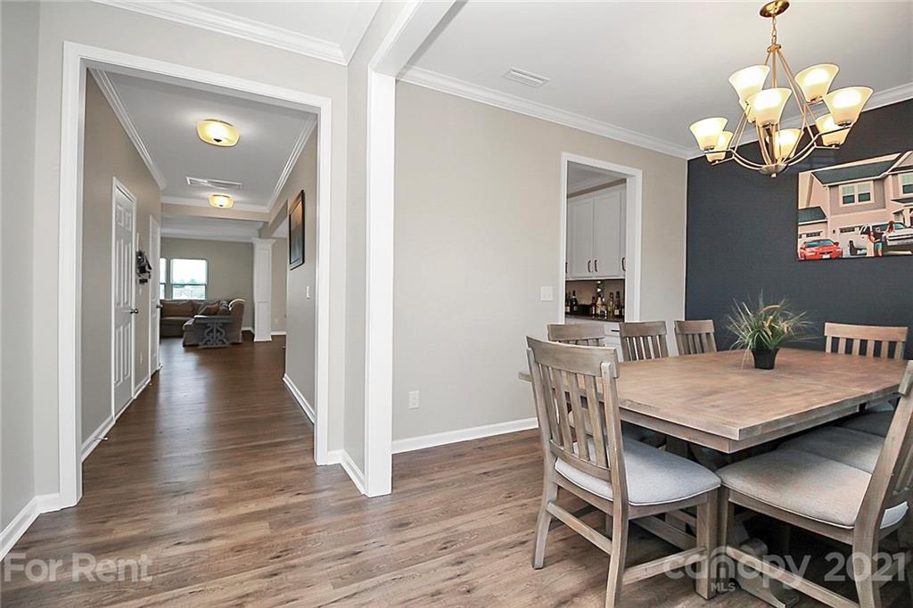 4925 Grace View Drive Pineville, NC 28134 - Photo 2 of 41 a view of a dining room with furniture and wooden floor