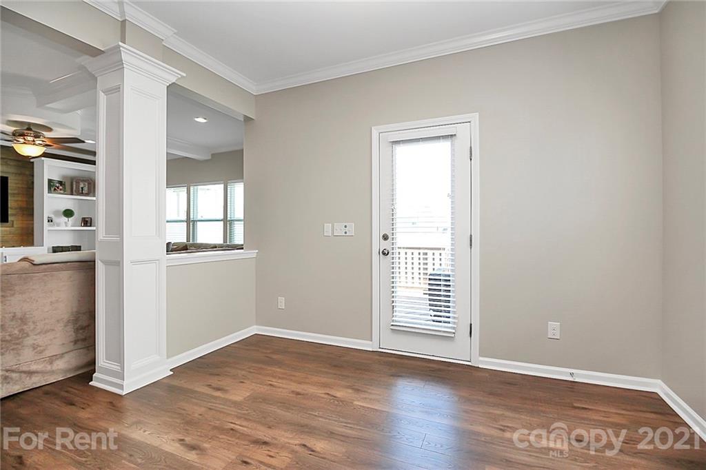 4925 Grace View Drive Pineville, NC 28134 - Photo 13 of 41 an empty room with wooden floor and windows