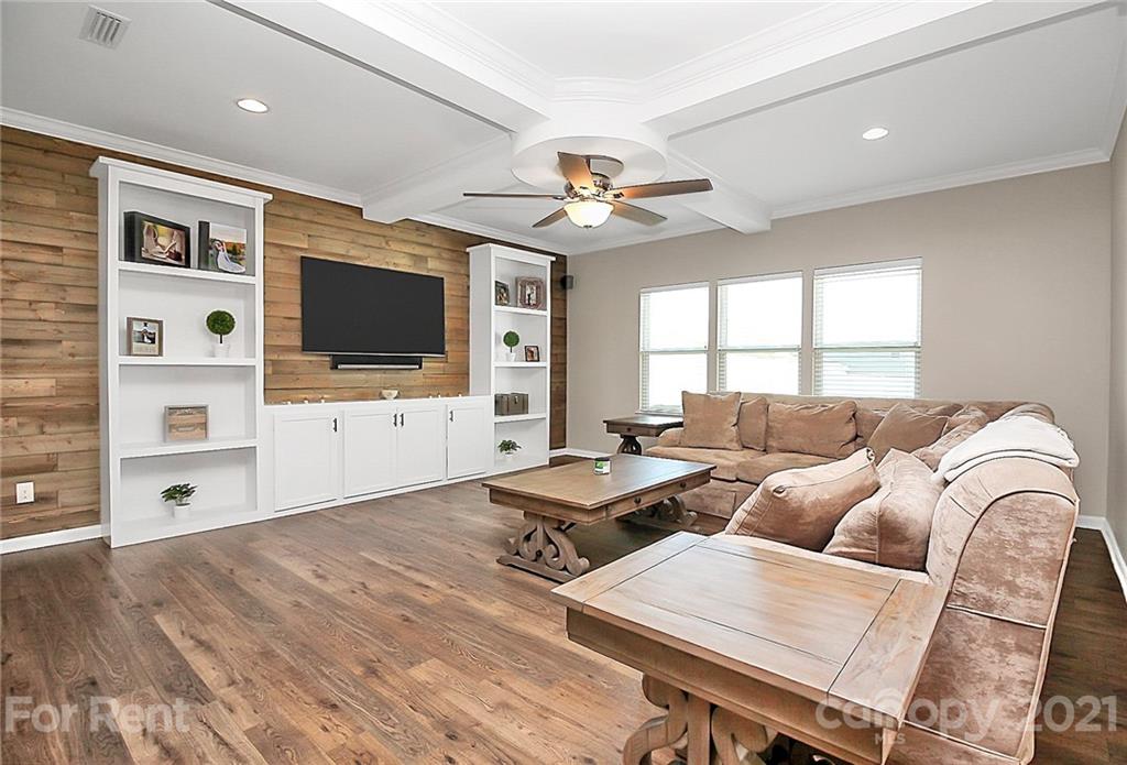 4925 Grace View Drive Pineville, NC 28134 - Photo 14 of 41 a living room with furniture and a flat screen tv