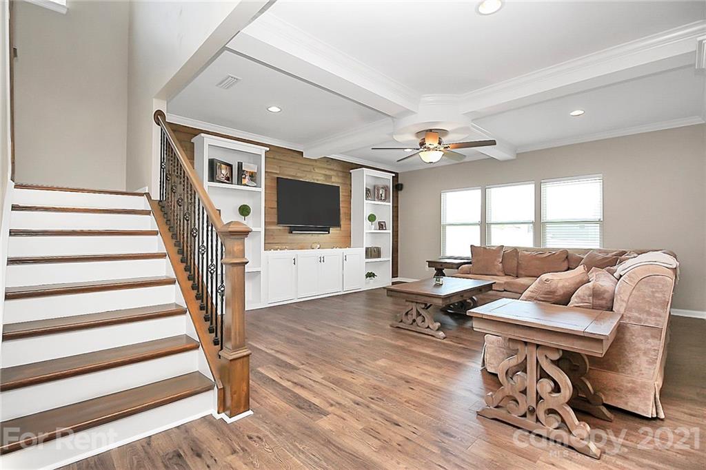 4925 Grace View Drive Pineville, NC 28134 - Photo 15 of 41 a living room with furniture and a flat screen tv