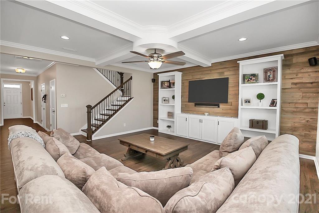 4925 Grace View Drive Pineville, NC 28134 - Photo 18 of 41 a living room with furniture and a flat screen tv