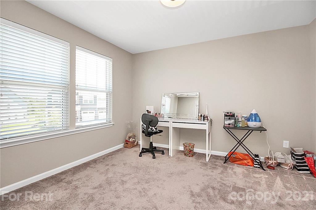 4925 Grace View Drive Pineville, NC 28134 - Photo 27 of 41 a view of a workspace with furniture and a window