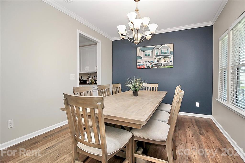 4925 Grace View Drive Pineville, NC 28134 - Photo 4 of 41 a view of a dining room with furniture and wooden floor