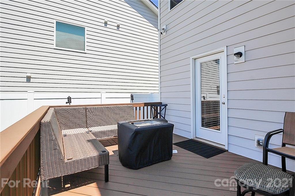 4925 Grace View Drive Pineville, NC 28134 - Photo 34 of 41 a view of table and chair with wooden floor and roof