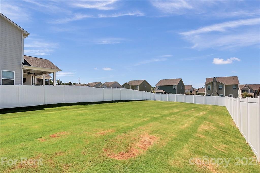 4925 Grace View Drive Pineville, NC 28134 - Photo 35 of 41 a view of a patio with a table and chairs