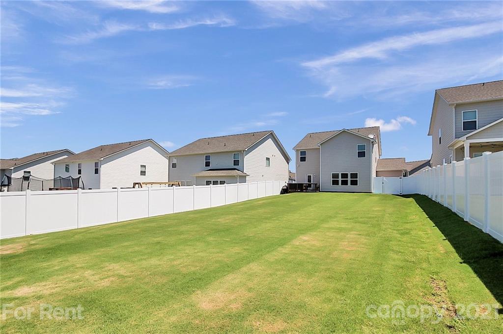 4925 Grace View Drive Pineville, NC 28134 - Photo 36 of 41 a front view of house with yard and trees