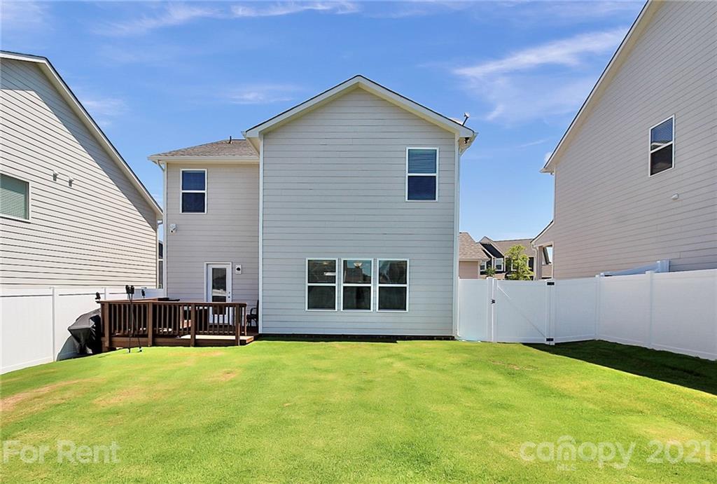 4925 Grace View Drive Pineville, NC 28134 - Photo 37 of 41 a view of a house with a yard and sitting area