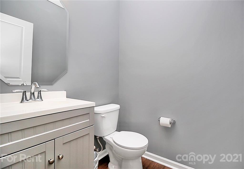 4925 Grace View Drive Pineville, NC 28134 - Photo 5 of 41 a white toilet sitting next to a bathroom sink