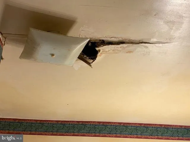 a kitchen with granite countertop stainless steel appliances stove top oven and cabinets