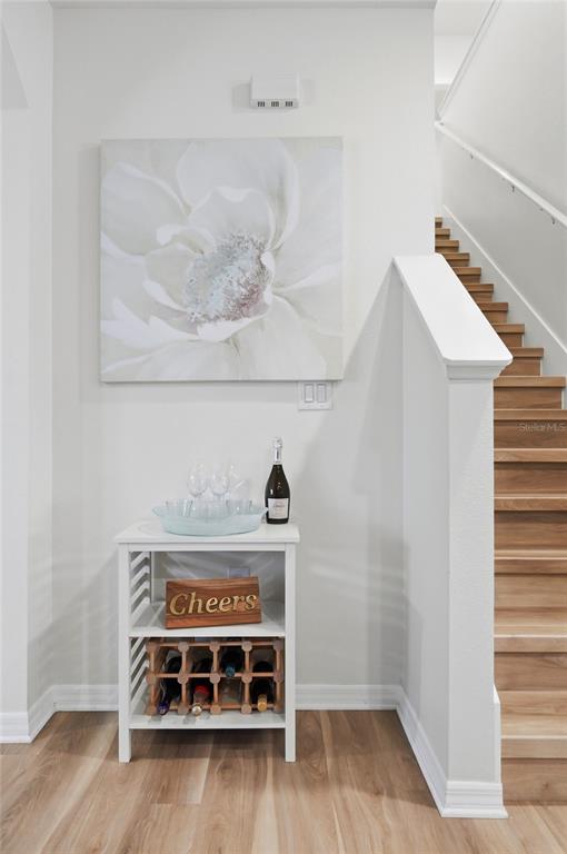 416 Corso Loop Winter Haven, FL 33884 - Photo 12 of 73 a view of a room with wooden floor and cabinet