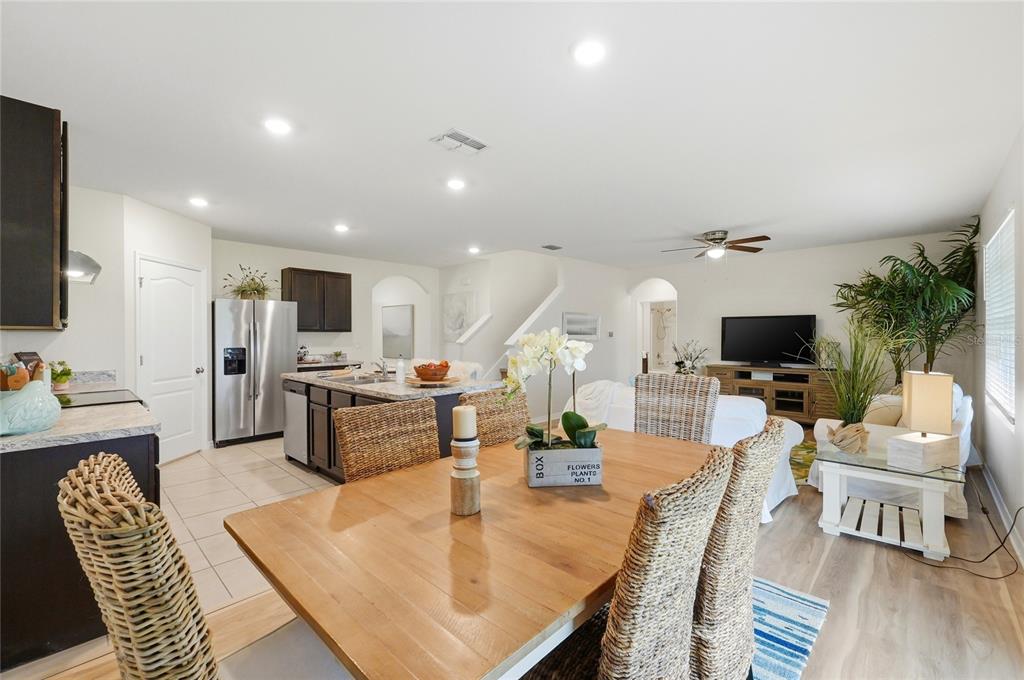416 Corso Loop Winter Haven, FL 33884 - Photo 19 of 73 a living room with furniture kitchen view and a flat screen tv