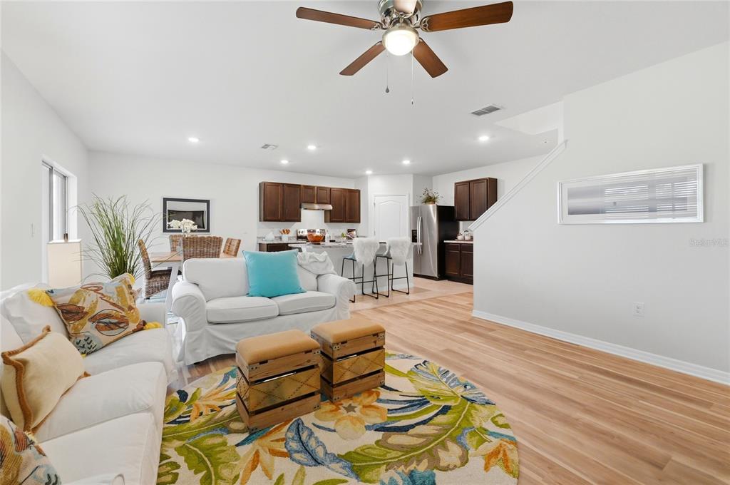 416 Corso Loop Winter Haven, FL 33884 - Photo 22 of 73 a living room with furniture and a wooden floor