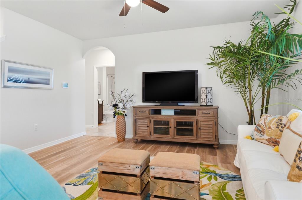 416 Corso Loop Winter Haven, FL 33884 - Photo 24 of 73 a bedroom with a bed and a flat screen tv