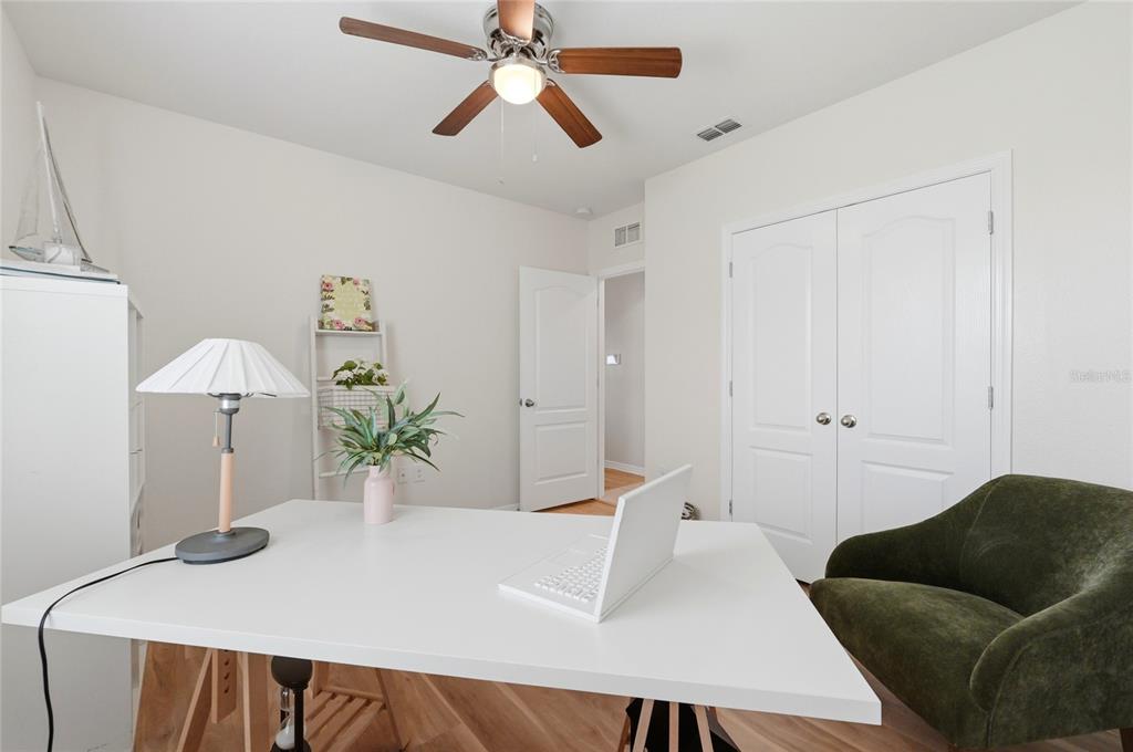 416 Corso Loop Winter Haven, FL 33884 - Photo 25 of 73 a living room with furniture and a potted plant